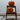 Pumpkins on wooden chair in hallway
