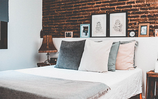 Bedroom with Brick Wall