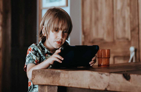 Child with table on Reclaimed Wood Dining Table