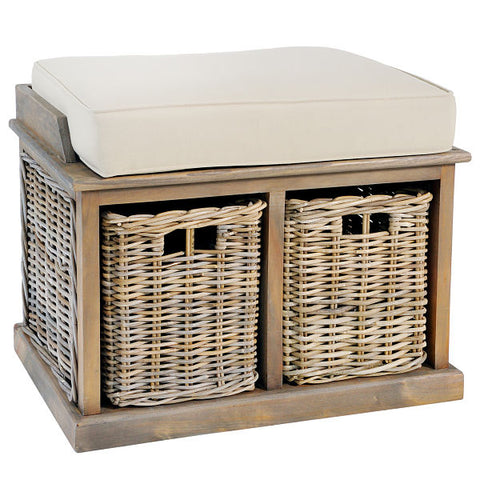 A soft cream coloured cushion on a small wooden bench with two wicker baskets underneath.