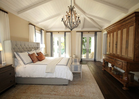 Bed in bedroom with wardrobe