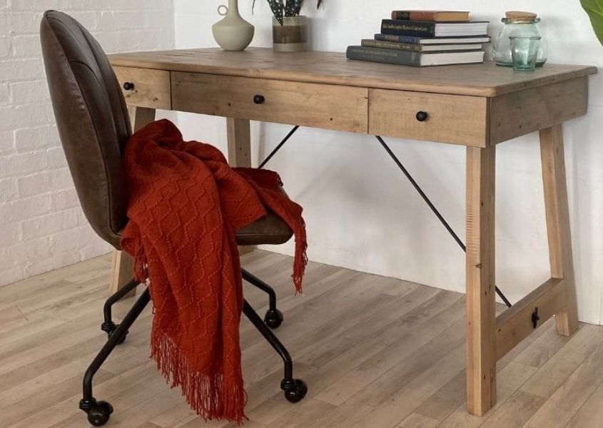Brown faux leather office chair and wooden desk