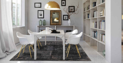 Louis De Poortere Fading World Rug - Atlantic Deep in dining room with dining chairs and table