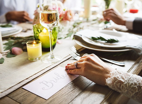 Reclaimed wood dining table for outdoor wedding in garden