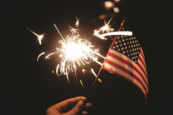 American flag on independence day with sparkler 