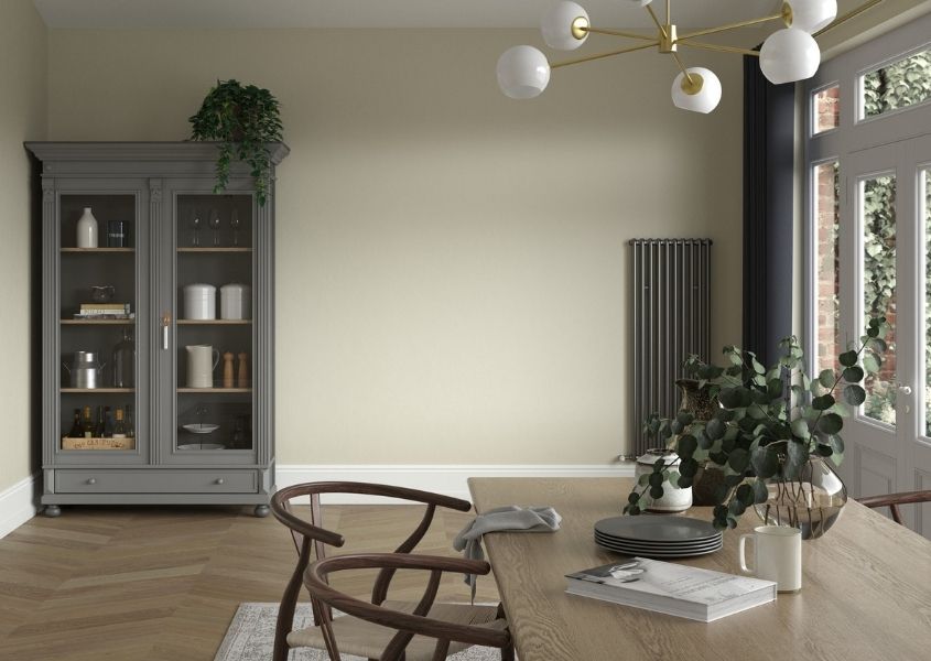 large wooden dining table with grey painted kitchen dresser